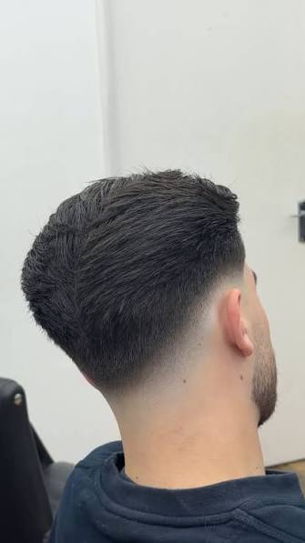Finished skin fade result on a Fade & Co. client